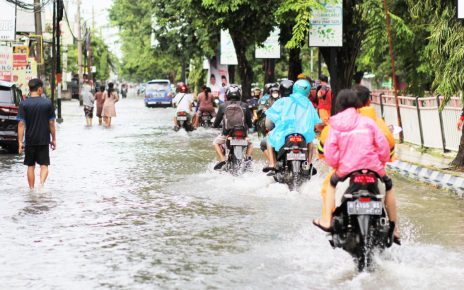 Tourists Surfing In The Street As Bali Resorts Flood